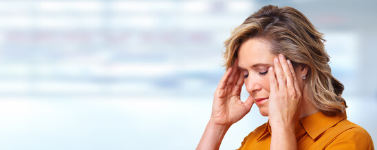 Woman having headache migraine